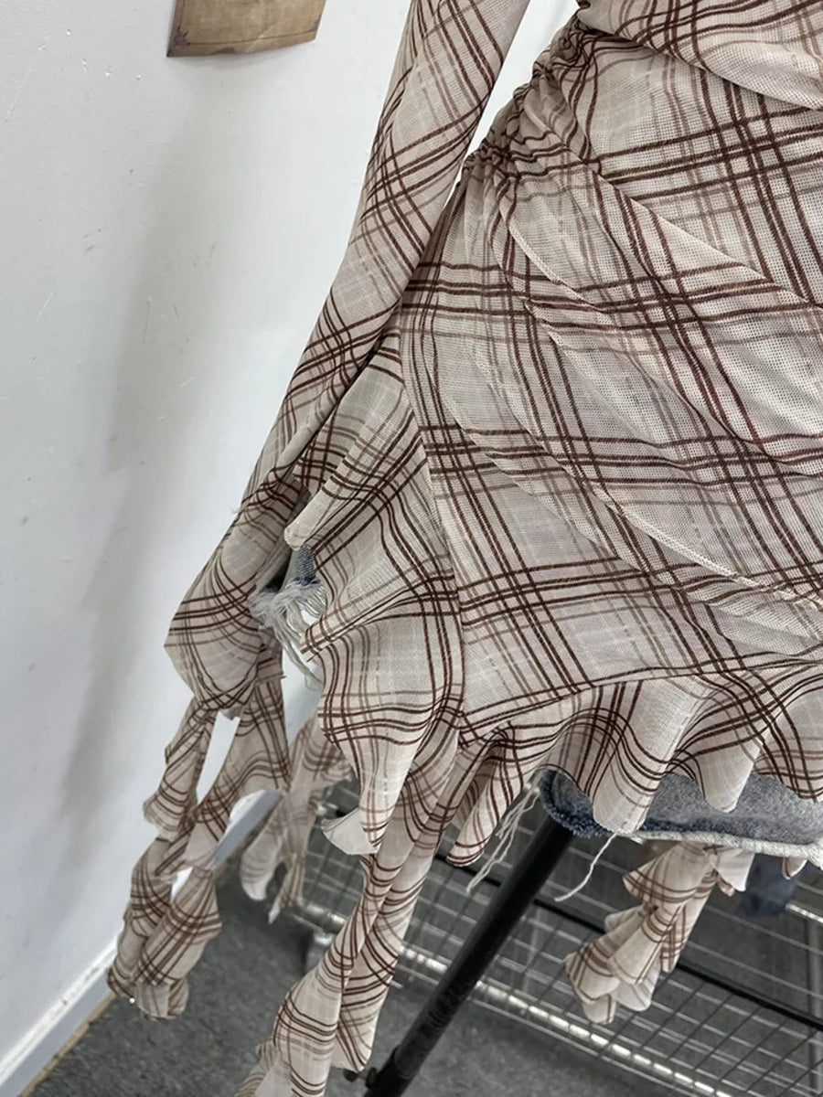 Taupe plaid asymmetrical ruffle hem t-shirt with distressed details.