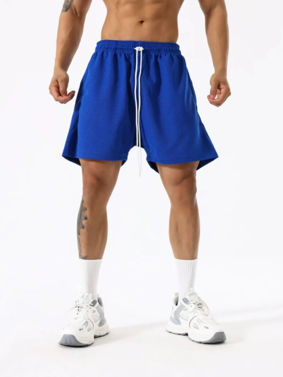 Royal blue athletic drawstring lounge shorts with white drawstrings.