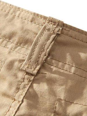 Khaki cargo shorts detail with reinforced stitching and belt loop.
