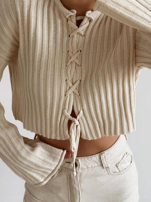 Apricot pullover sweater featuring lace-up and ribbed