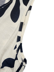 Belted dress with tropical leaf print, decorative buttons, and white trim detail.