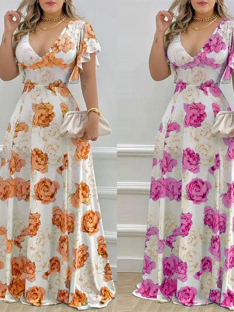 Maxi dress with V-neck, ruffle sleeves, and floral print in pumpkin or fuchsia pink.