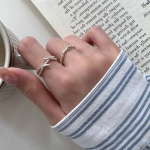 Silver ring featuring open ring and geometric