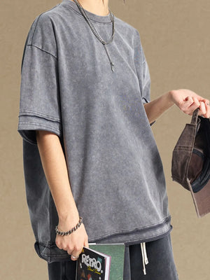 Washed cotton tee in gray with raw edges and double-stitched details.