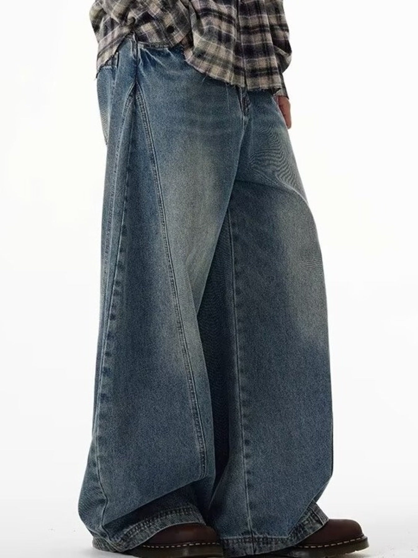 Men's blue cotton wide leg jeans with a relaxed fit.