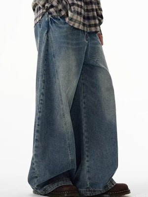 Men's blue cotton wide leg jeans with a relaxed fit.