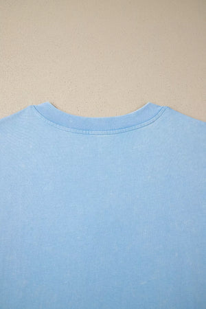 Light blue cotton relaxed V-neck top with ribbed neckline