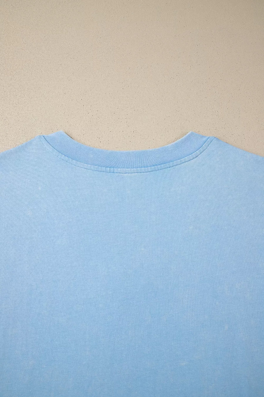 Light blue cotton relaxed V-neck top with ribbed neckline