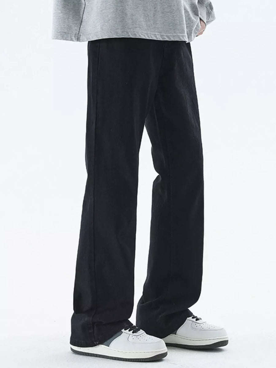 Black relaxed fit cotton jeans for men with a straight leg cut.