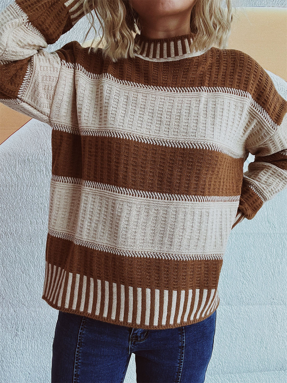 Textured stripe mock neck knit sweater in caramel and cream with ribbed details.