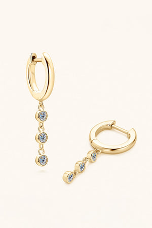 Gold dangling gemstone sterling hoop earrings with three clear stones each.