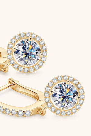 Gold pavé halo drop earrings with a central round-cut crystal.