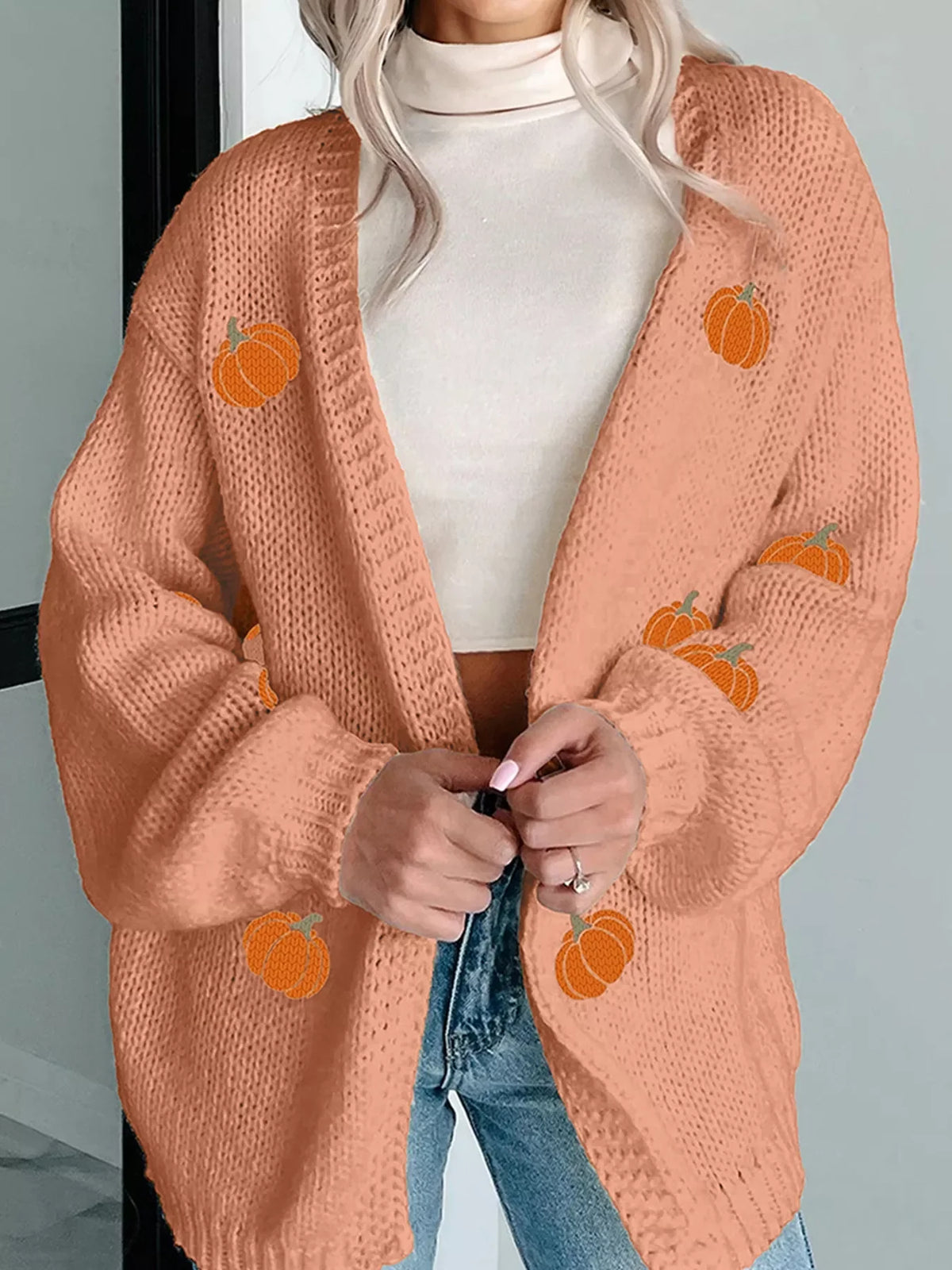 Embroidered pumpkin midi cardigan in sherbet with a relaxed fit and open front.