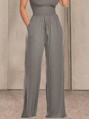 Gray smocked wide-leg jumpsuit with drawstring waist and pockets