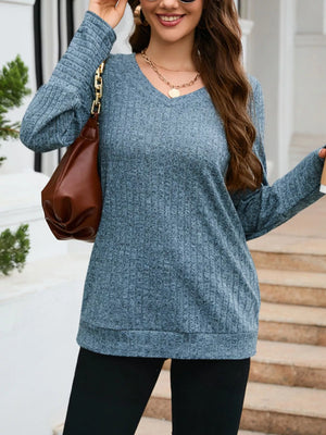 Blue textured V-neck knit long-sleeve top with a relaxed fit.