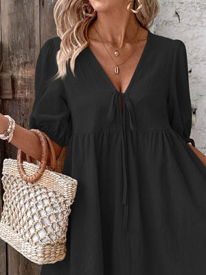 Black tie front puff sleeve mini dress with v-neck and adjustable tie