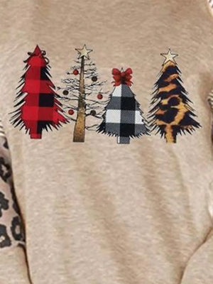 Tan raglan sleeve sweatshirt with festive Christmas tree prints in buffalo check and leopard patterns.