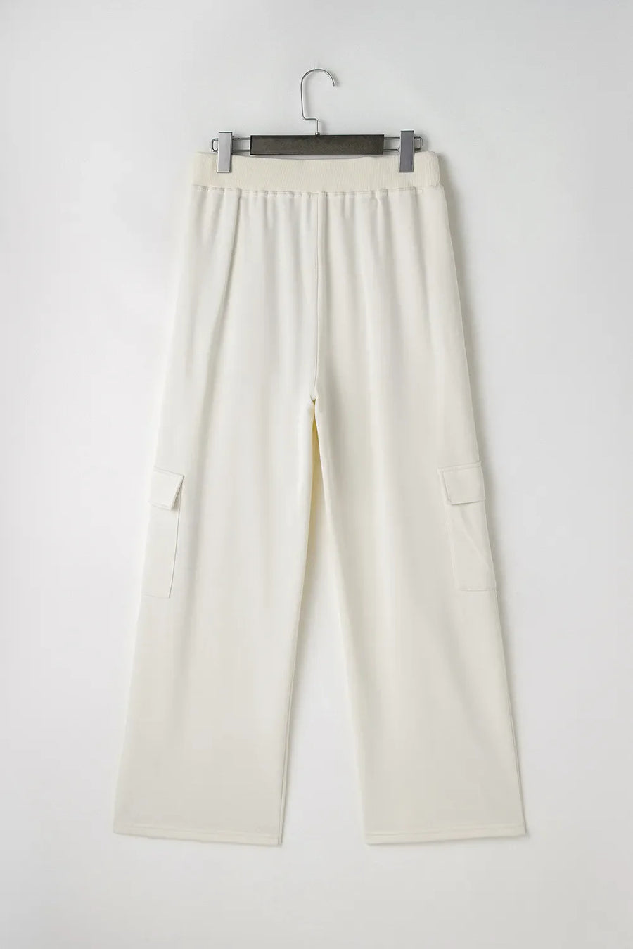 Ivory wide leg cargo pants with elastic waistband and patch pockets.