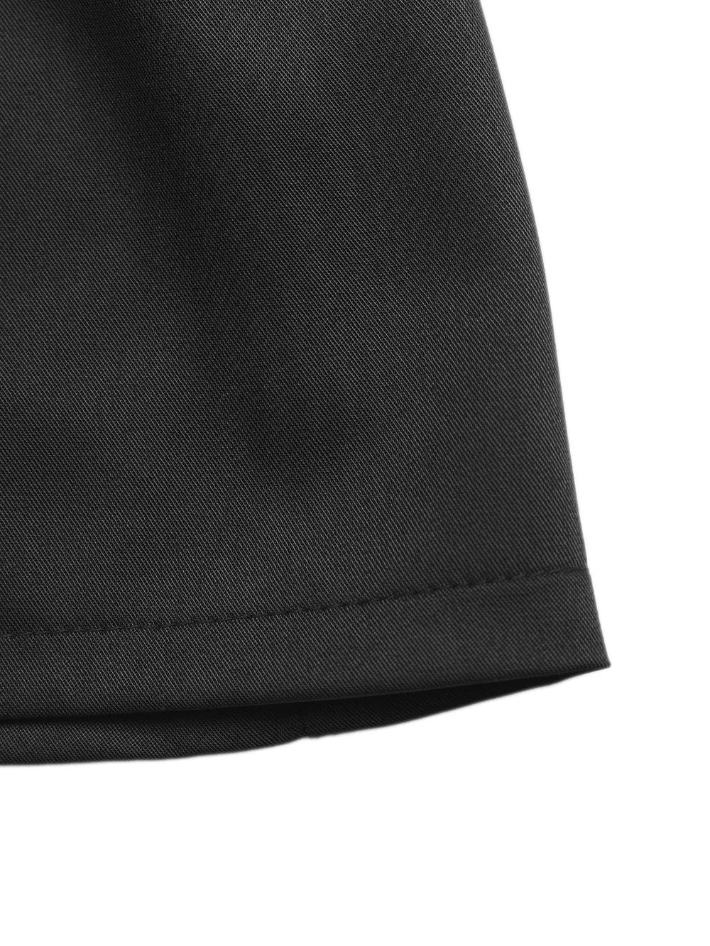 Black high-waisted pleated chino shorts with a decorative button detail.