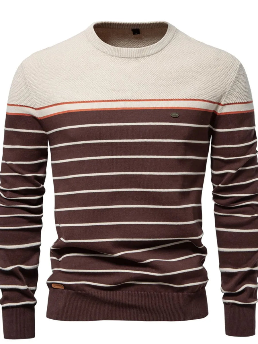 Crewneck sweater with horizontal stripes in brown, ivory, and orange.