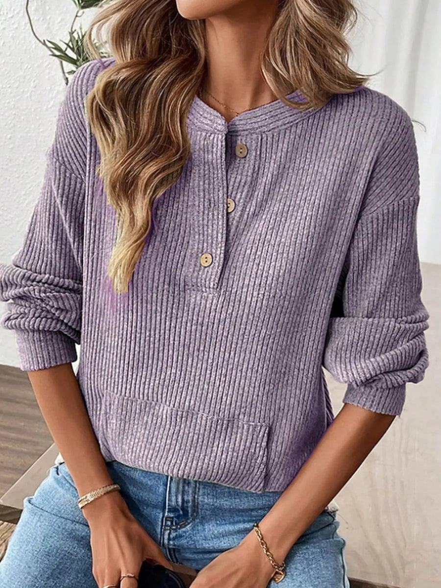 Lavender ribbed long-sleeve top with button detail and front pocket.