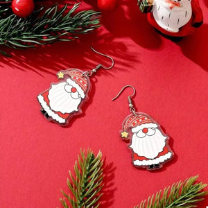 Red Santa Claus acrylic dangle earrings with star detail.
