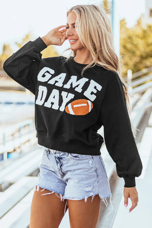 Black graphic sweatshirt with white "GAME DAY" text and football graphic