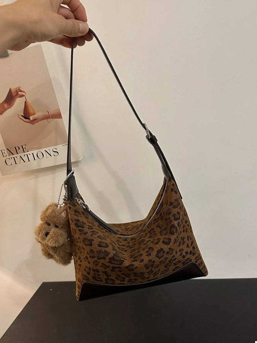 Leopard print shoulder bag with adjustable strap and teddy bear charm
