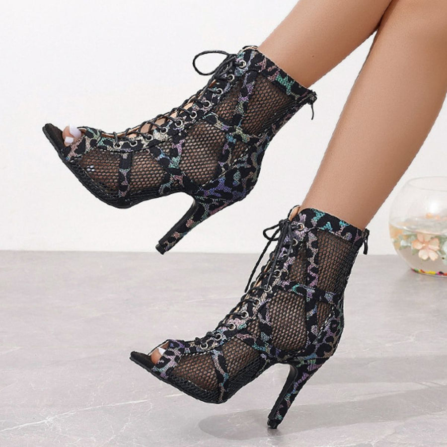 Black lace-up peep-toe ankle booties with animal print mesh and stiletto heel.