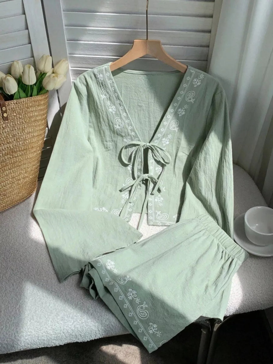 Light green embroidered tie-front top and shorts set with paisley trim.