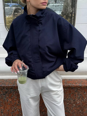 100% polyester Care instructions: Machine wash cold windbreaker in White with oversized silhouette