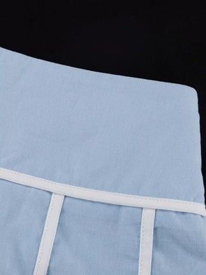 Light blue linen blend shorts with white piping and vertical seam details