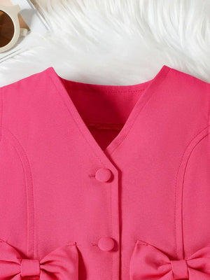 Pink baby vest with bow detail and button closure