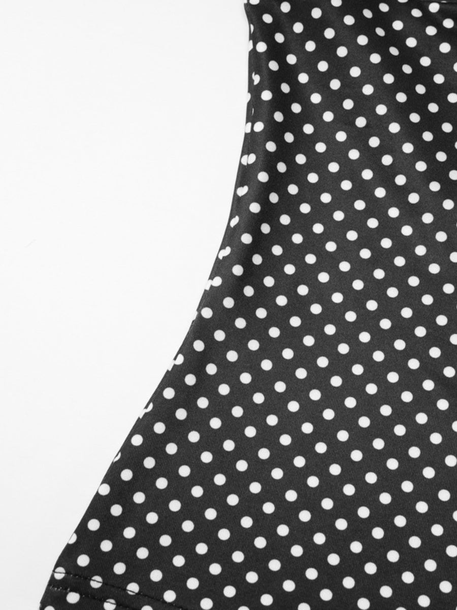 Black polka dot crop top and skirt set with ruffled detail
