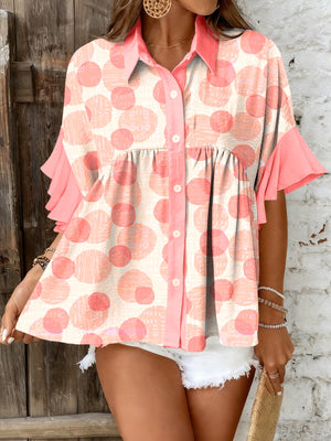 Polka dot babydoll blouse with ruffle sleeves and button front.