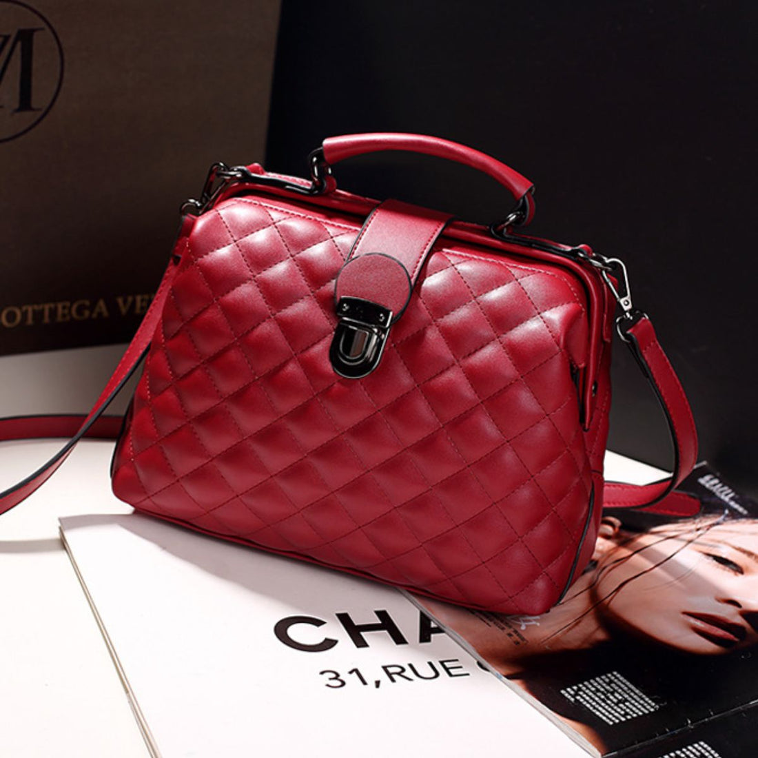 crossbody bag in burgundy featuring quilted and structured fit