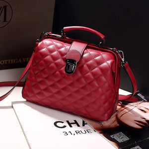 crossbody bag in burgundy featuring quilted and structured fit