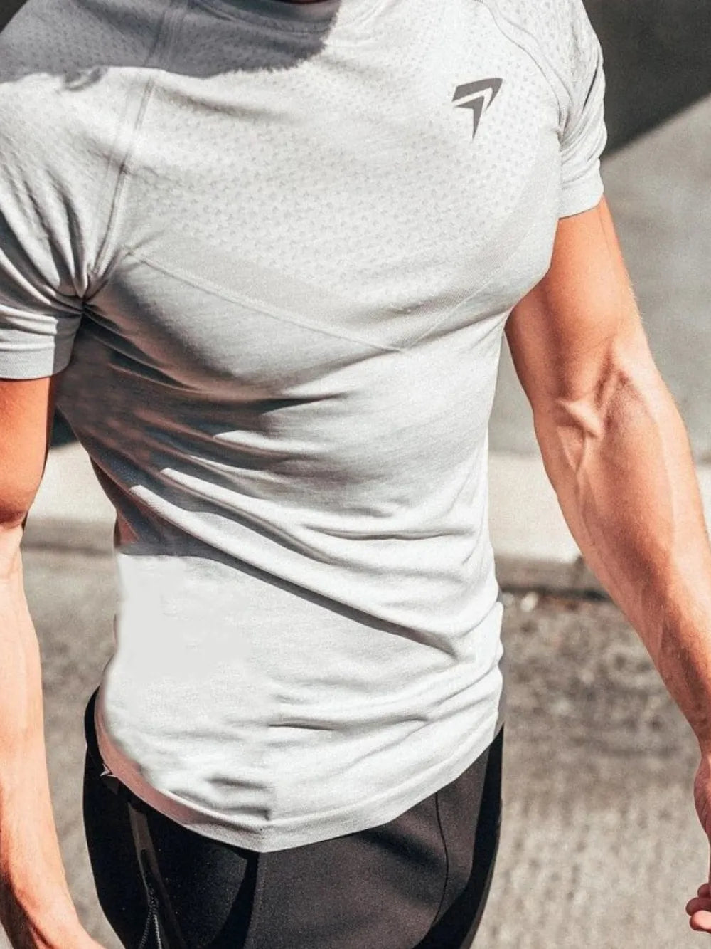 Performance Fit Raglan Sleeve Tee in light grey with subtle textured pattern and logo detail.