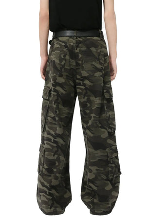 Wide-leg camo cargo pants with multiple pockets in green camouflage.