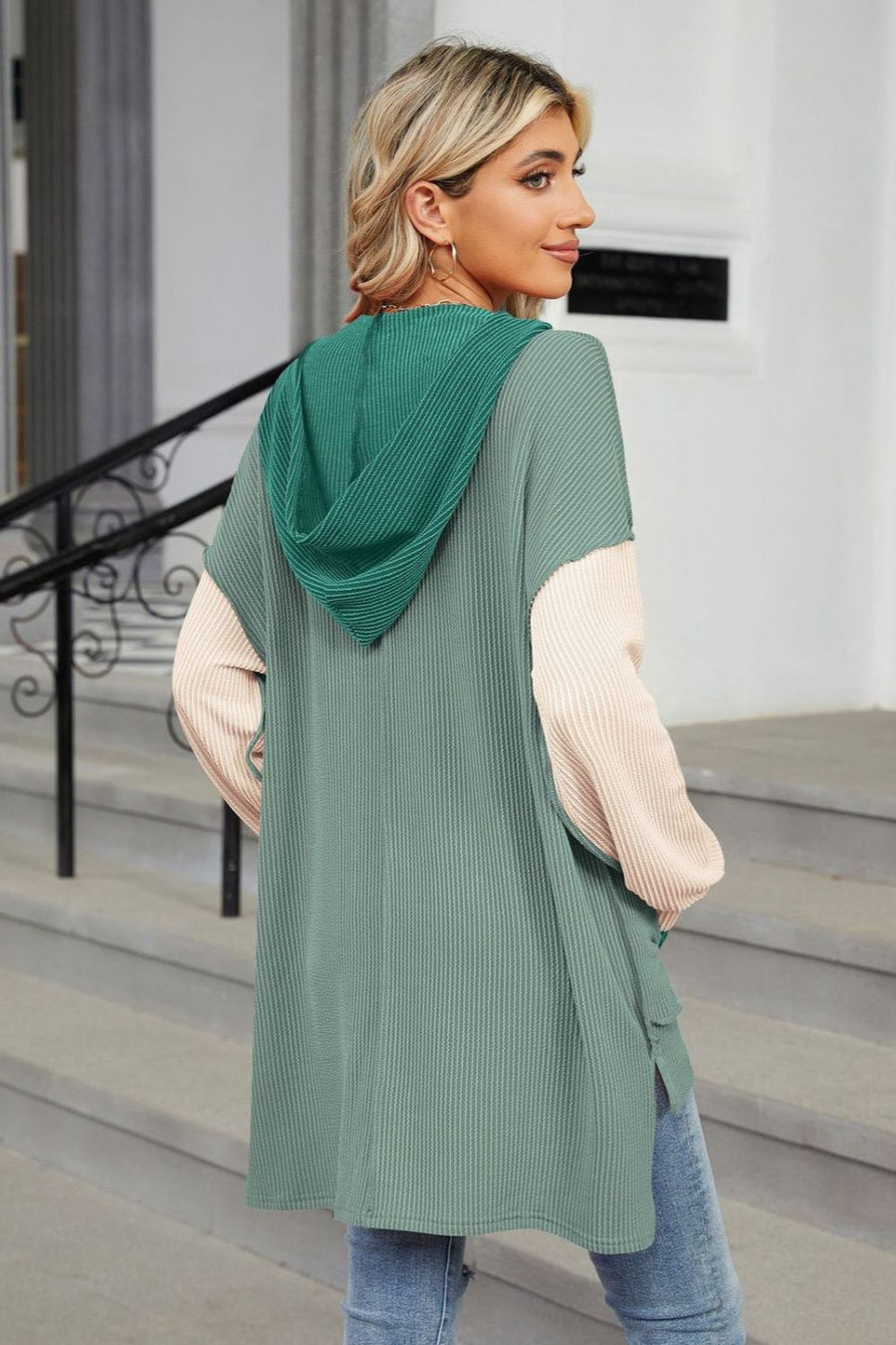 Green hooded tunic with colorblock sleeves and ribbed texture