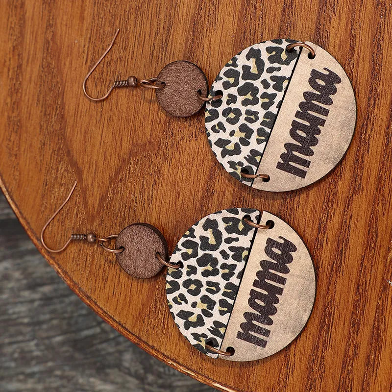 Leopard print "Mama" drop earrings with wooden accent, available in mocha and khaki.