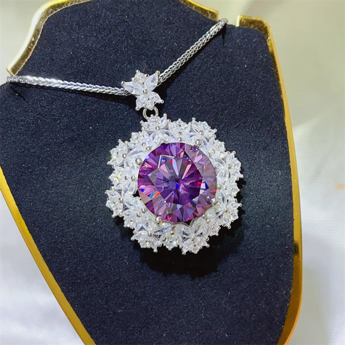 Amethyst pendant necklace with clear crystal halo and chain.