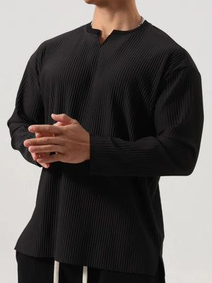 Black textured plissé henley long sleeve top with a notched neckline.