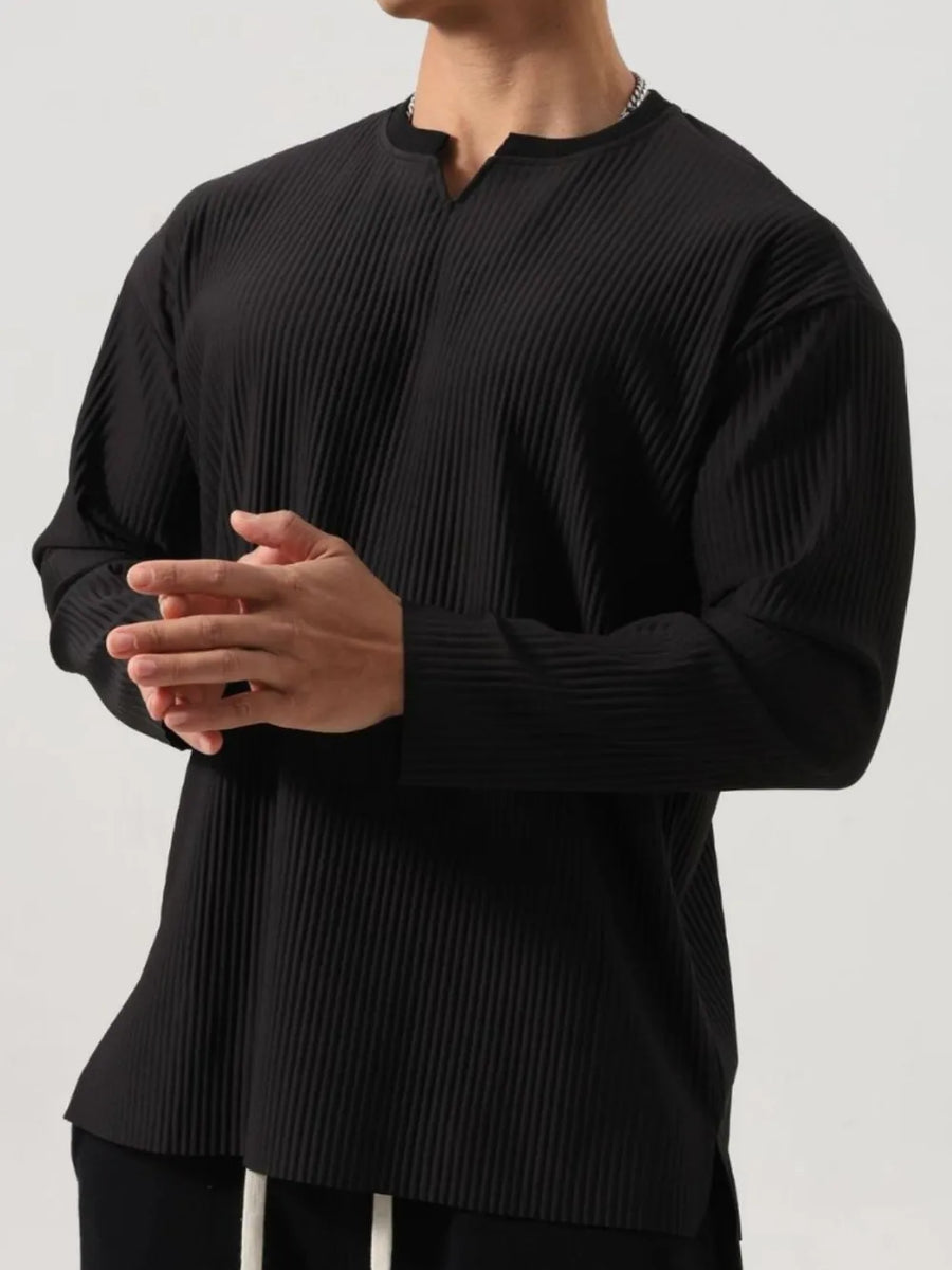 Black textured plissé henley long sleeve top with a notched neckline.