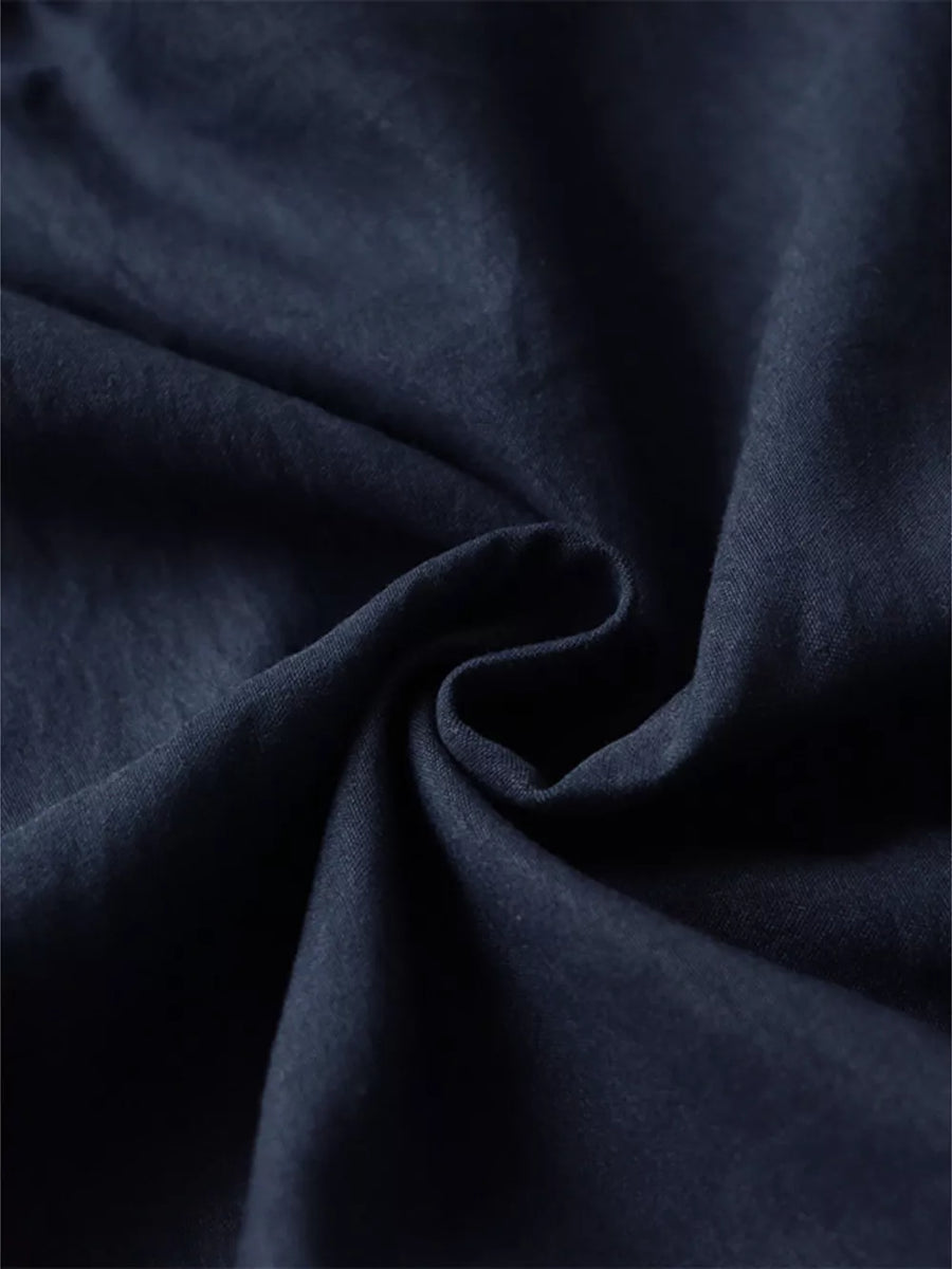 Navy blue textured fabric with a soft drape