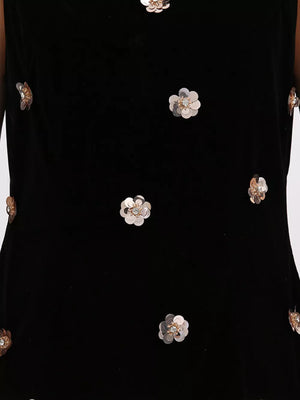 Black velvet sleeveless mini dress with allover rose gold sequin floral embellishments.