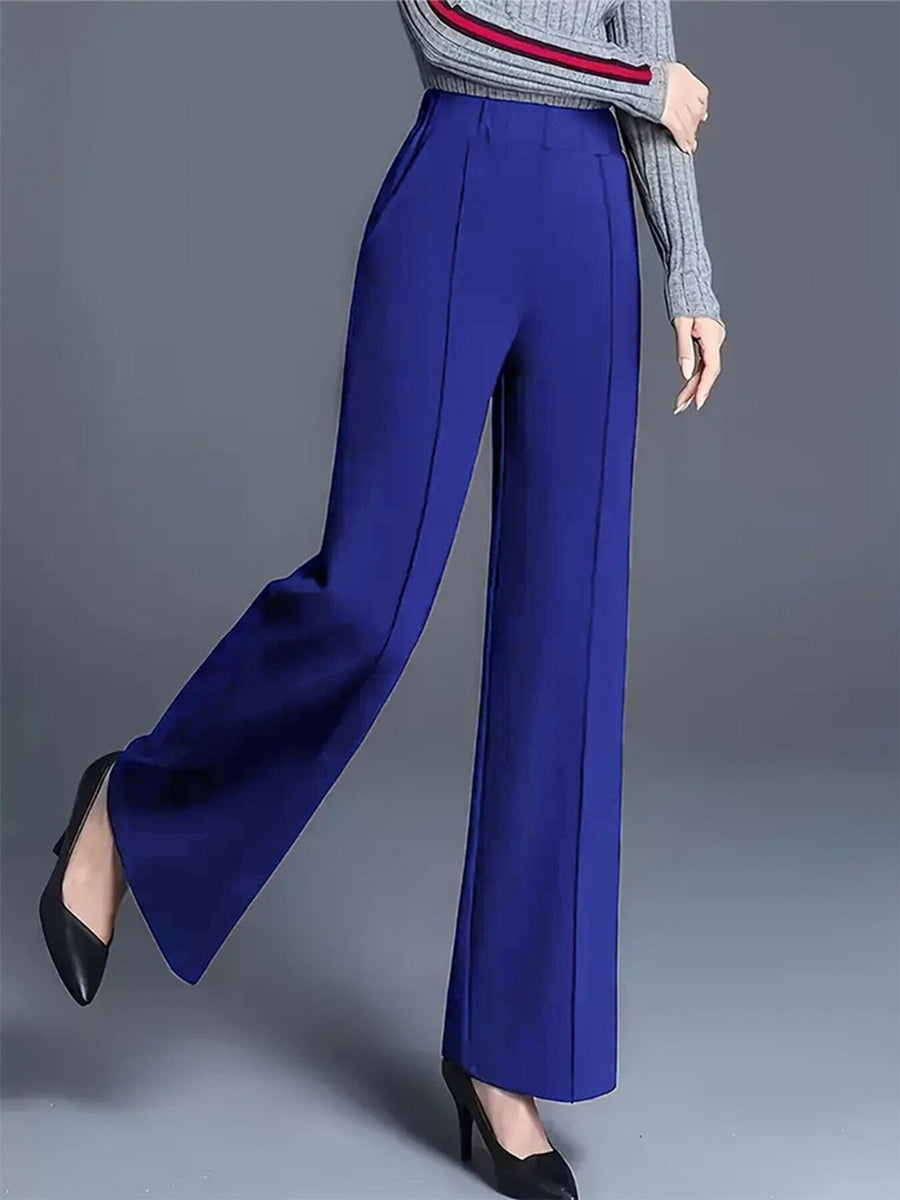 Blue high-waisted wide leg cotton trousers with pockets and front seam detail.