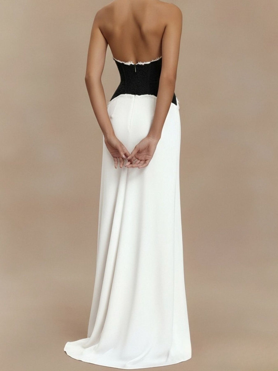 Black and white lace trim halter neck maxi dress with a flowing skirt.