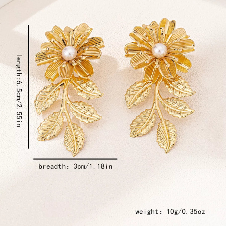 Golden floral drop earrings with pearl center and leaf accents, 18K gold-plated.