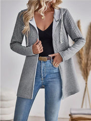 Grey cable-knit hooded zip jacket with white drawstring and zipper.